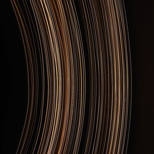 Abstract glowing lines representing the flow of energy and vitality.